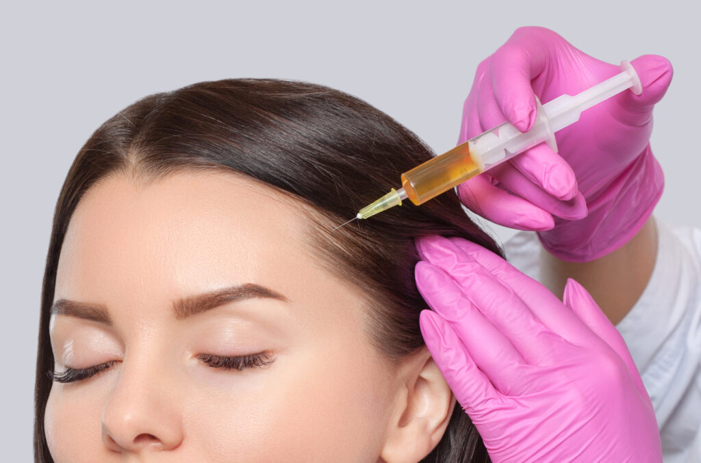 A Woman taking Hair restoration | Get Natural Growth Factor Injections at Golden Medical Aesthetics in Meridian, ID