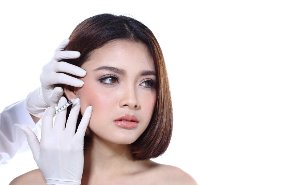 A Woman receiving injection on cheeks | Get Jawline Filler at Golden Medical Aesthetics in Meridian, ID